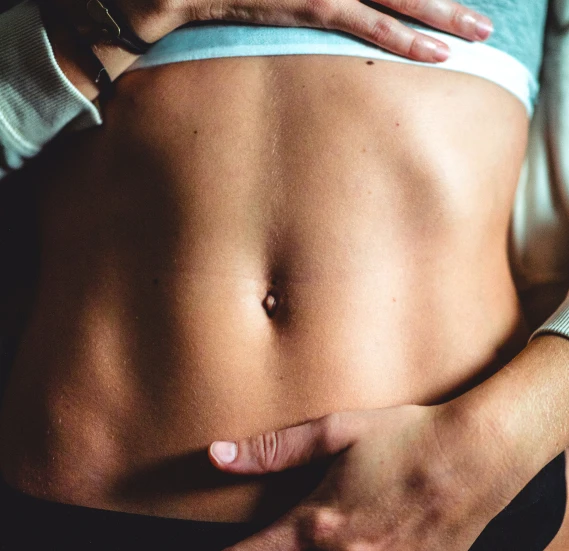 female-abs-teal-workout-clothes