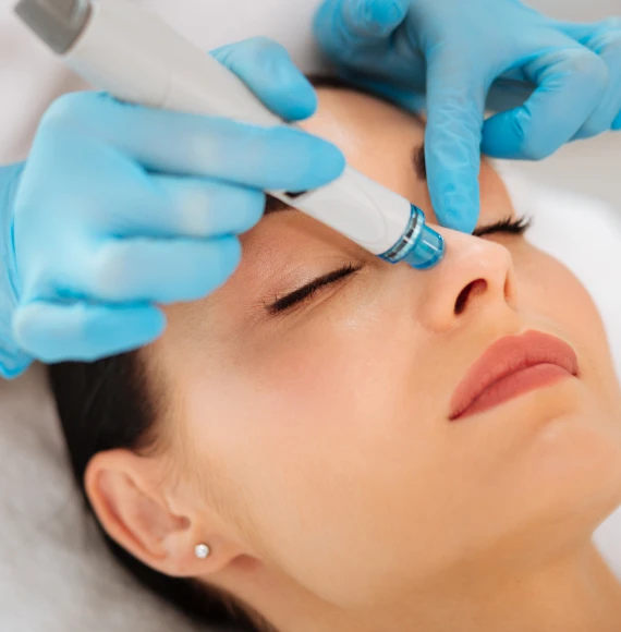 Woman-receiving-hydrafacial-blue-gloves-page
