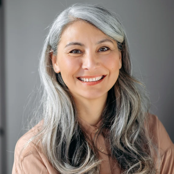 mature-asian-woman-long-silver-hair-page-wellness