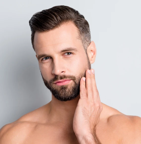 young-shirtless-man-holding-face-page-wellness